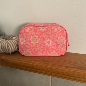 Pink and green paisley and floral makeup bag.